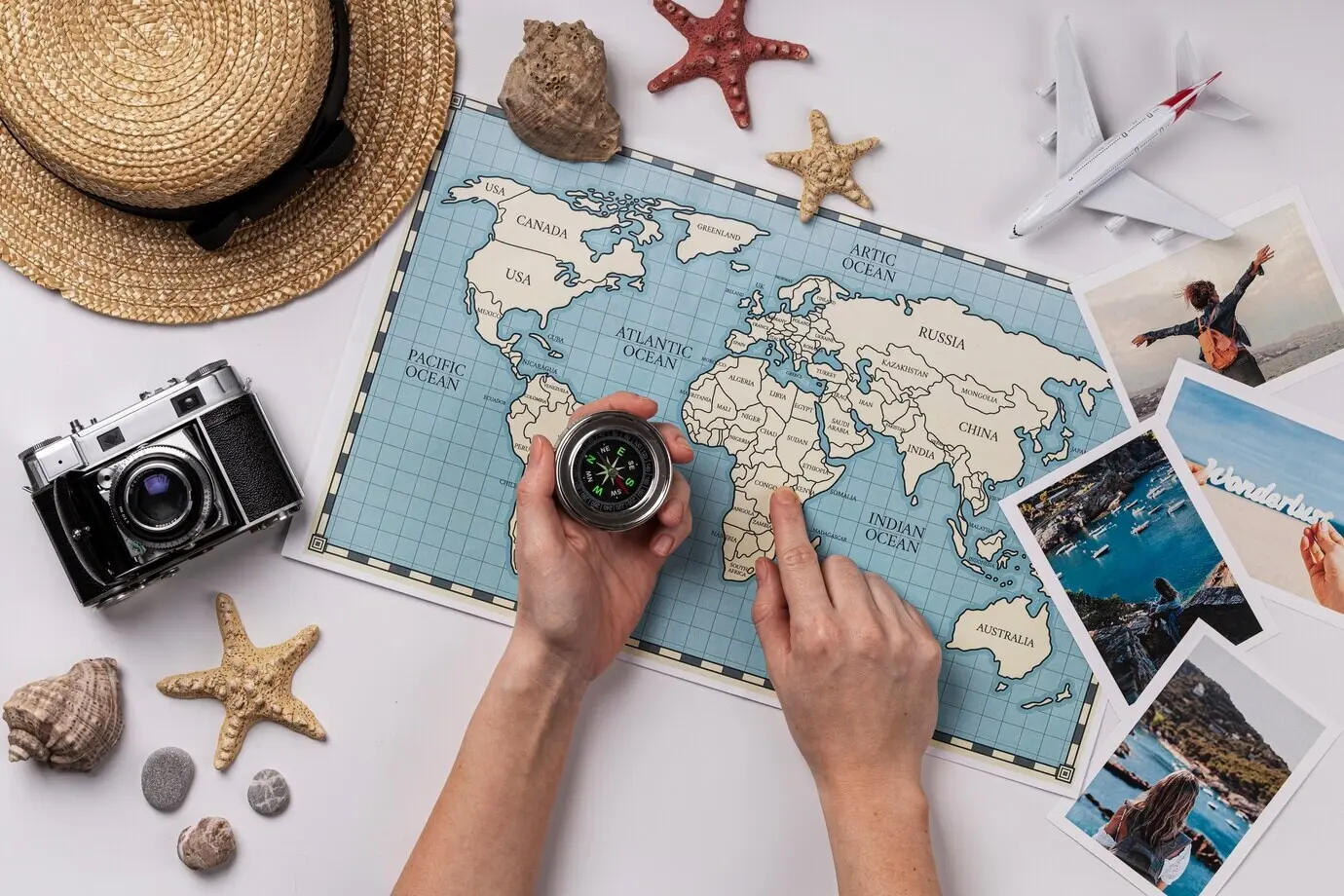 Overhead view of a hand holding a compass